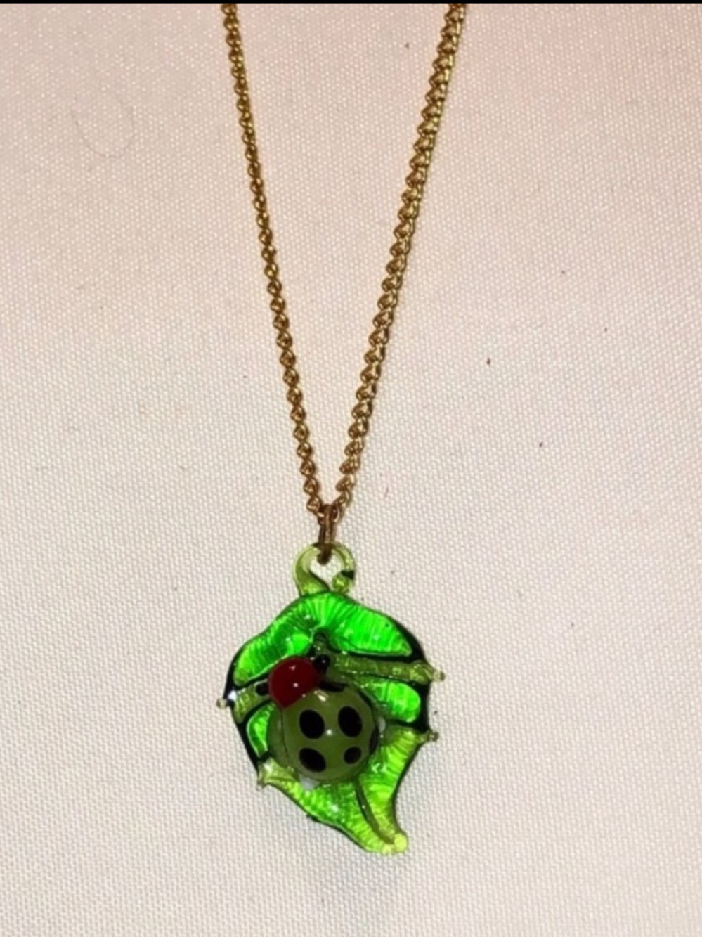 Enamel Ladybug on Leaf
Pendant Necklace with Gold-Tone Chain